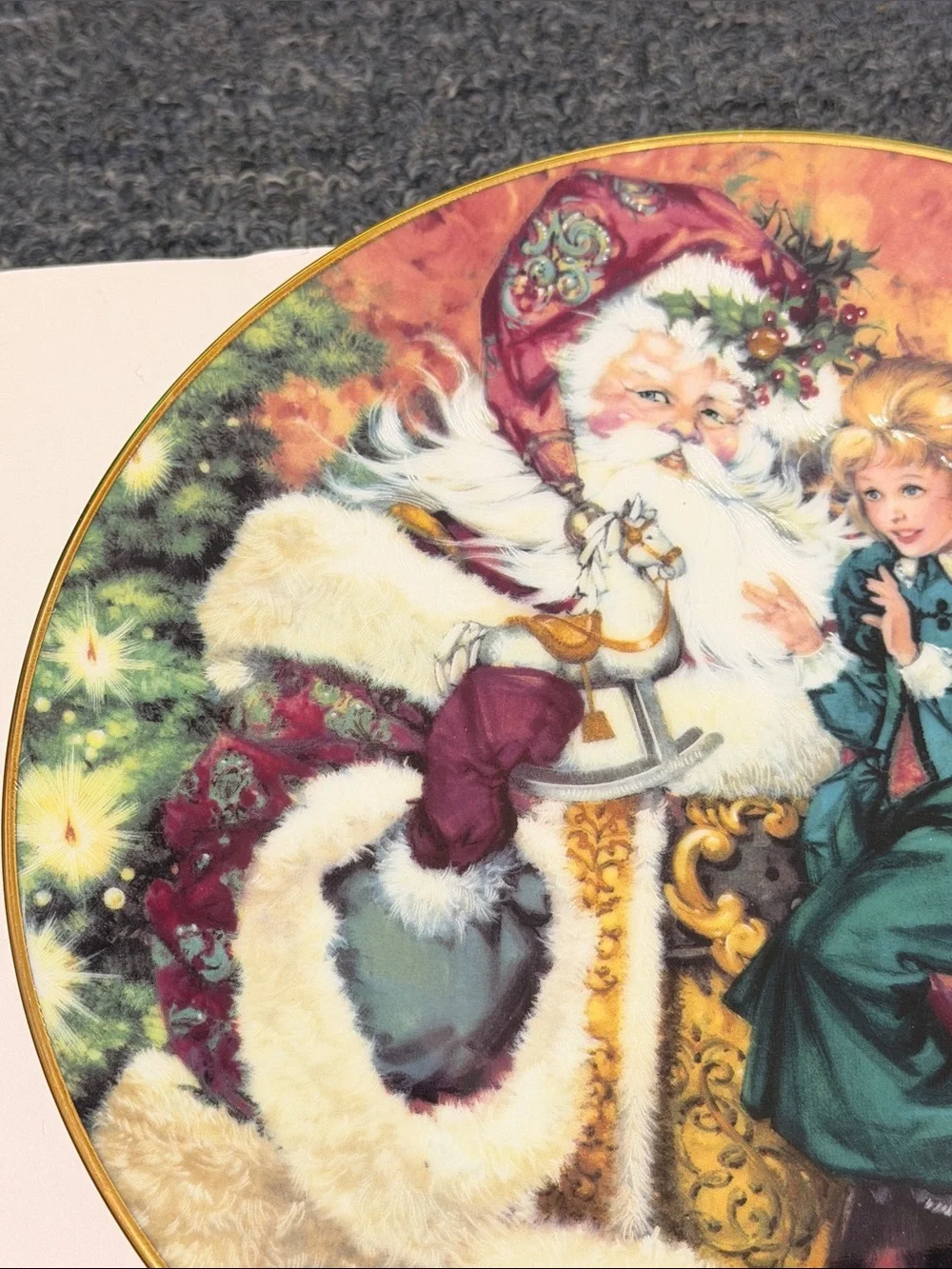 Avon 1994 Christmas Decorative Plate with Santa and Girl. 22K gold rim.